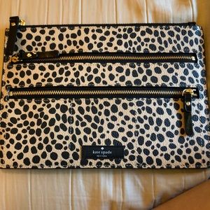 A Kate Spade toiletry purse